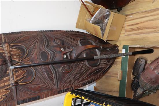 A Papua New Guinea large mask, other tribal masks and rattles